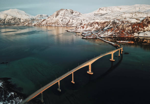 aerial view of a bridge at the lofoten - tromso fjord winter mountain imagens e fotografias de stock