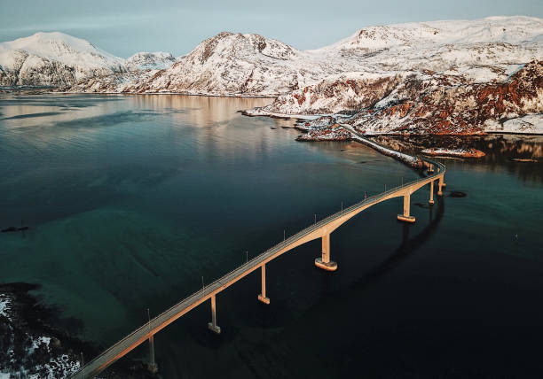 вид с воздуха на мост на lofoten - snow winter coastline sunrise стоковые фото и изображения