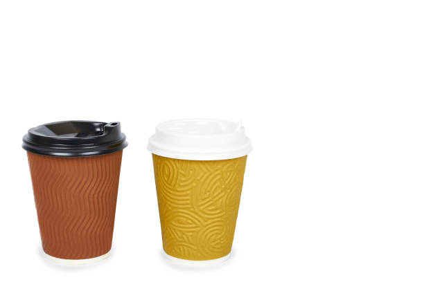 istock Two take out coffee in thermo cup. Isolated on a white background. Disposable container, hot beverage. copy space, template 946437378