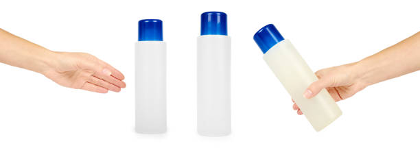istock set of different plastic bottle for shampoo or liquid soap with hand, isolated on white background. Hydiene and cleaning idea 946437952