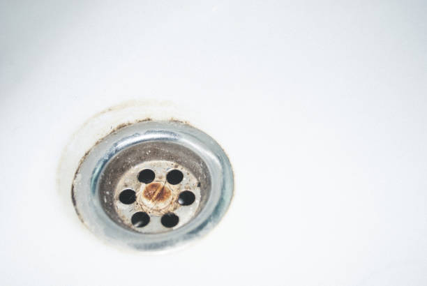 istock Old used rusty draining point of basin in toilet 946441838