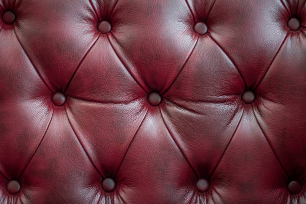 istock Closeup texture of vintage red leather sofa for background 946441866