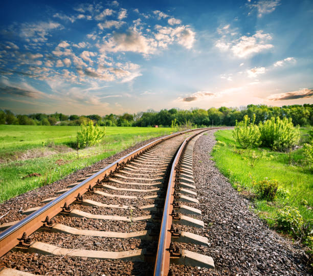 istock Landscape with a railway among a green field 946464922