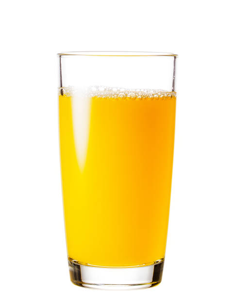 istock Process of pouring orange juice into a glass 946465070