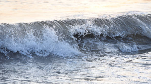 istock Beautiful dynamic wave in the sea with spray. Evening 946476148