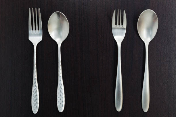 istock stainless steel spoon on black wood background. 946480052