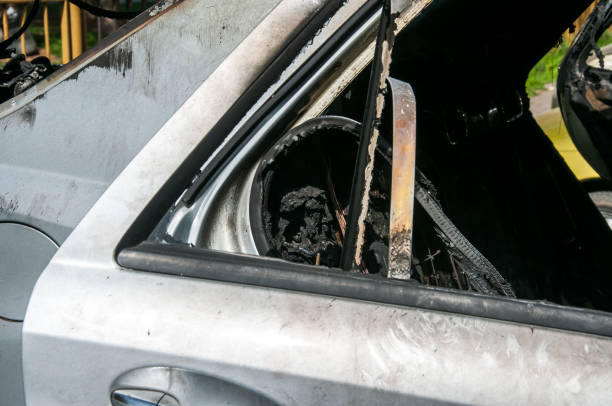 istock Total damage on new expensive burned car in fire on the parking lot, selective focus 946480628