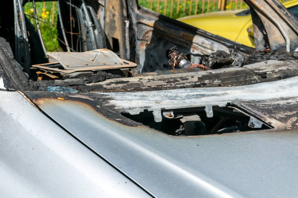 istock Total damage on new expensive burned car in fire on the parking lot, selective focus 946480644