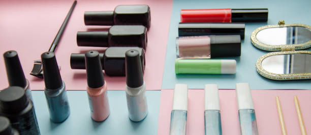 istock Make up set on pastel background top view. Manicure fashion modern bright background 946480720