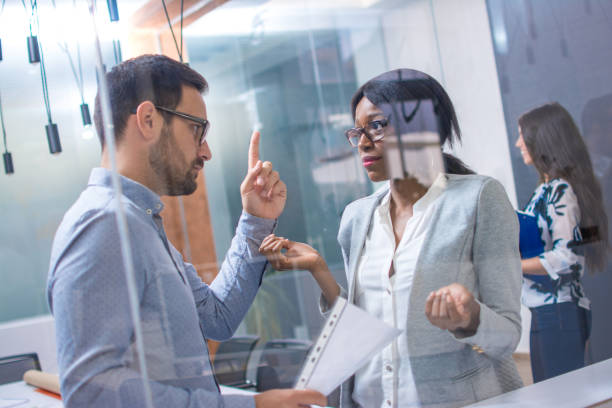 istock Boss threatening with finger his employee in office 946483300