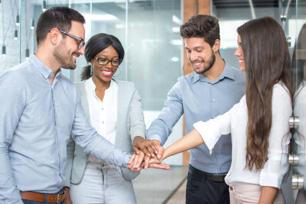 istock Business team showing unity with their hands together 946486226
