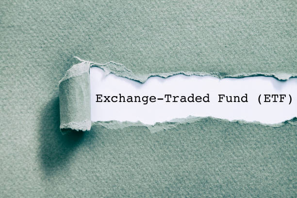 Exchange Traded Fund (ETF) Exchange Traded Fund (ETF) written under torn paper. exchange traded fund stock pictures, royalty-free photos & images