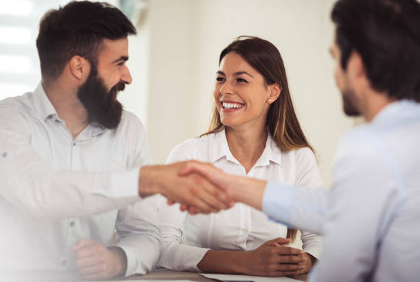 istock Business people shaking hands 946502794