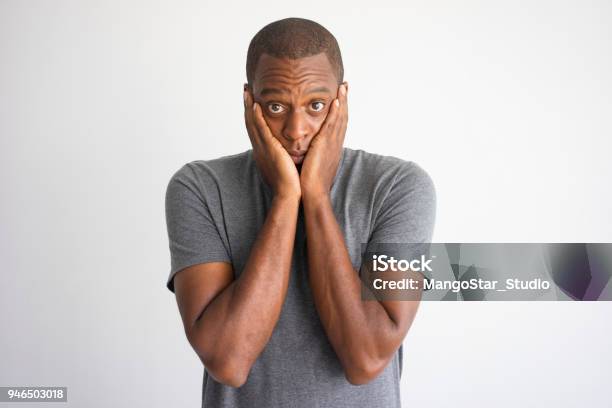 Portrait Of Shocked And Puzzled African American Stock Photo - Download Image Now - Men, Worried, Sadness