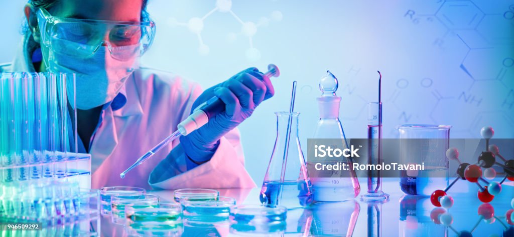 Chemistry Laboratory - Woman With Pipettes And Test Tubes Woman With Pipette And Test Tubes Laboratory Stock Photo