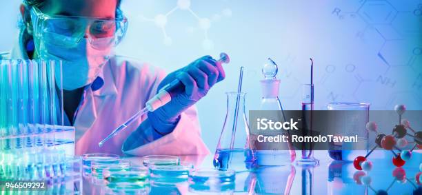 Chemistry Laboratory Woman With Pipettes And Test Tubes Stock Photo - Download Image Now