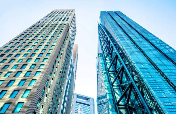 istock looking up view of skyscraper in Shiodome, Tokyo, Japan 946512866