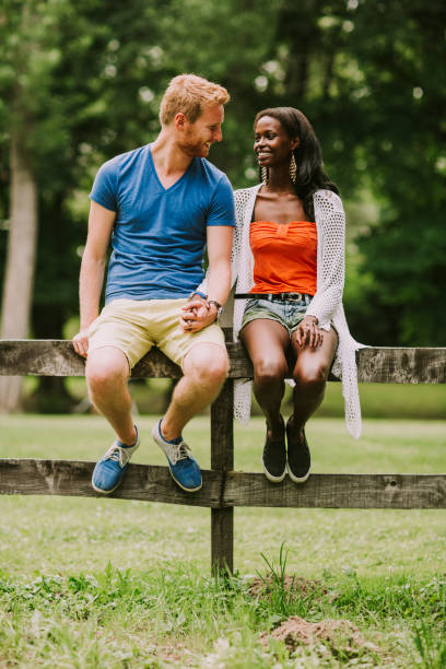 istock Multiracial couple in the park 946520720
