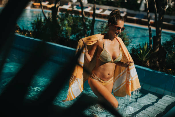 istock Young woman in bikini 946521240