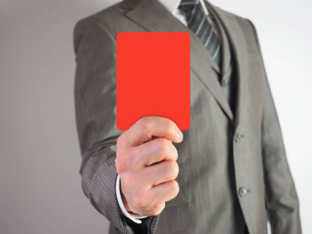 istock A businessman presenting a red card against a violation 946521284