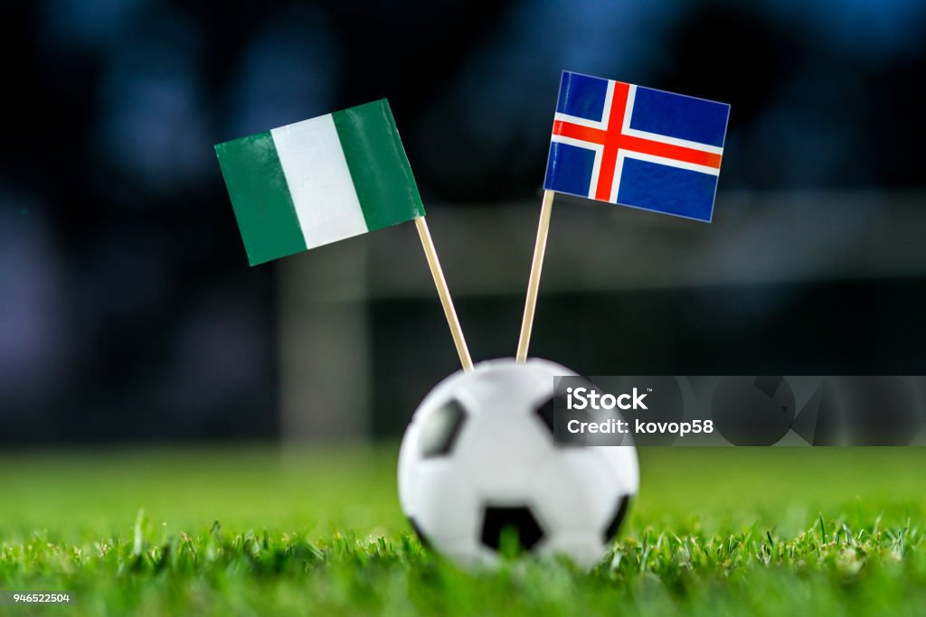 Nigeria - Iceland, Group D, Friday, 22. June, Football, World Cup, Russia 2018, National Flags on green grass, white football ball on ground. Africa Stock Photo