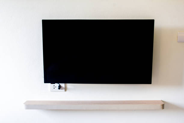 istock Black LED tv television screen blank on wall background 946525038