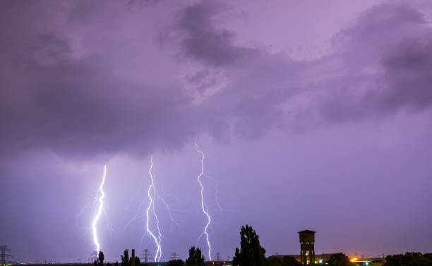 istock Lightning flash over a city, Thunderstorm , electricity blast storm 946525666