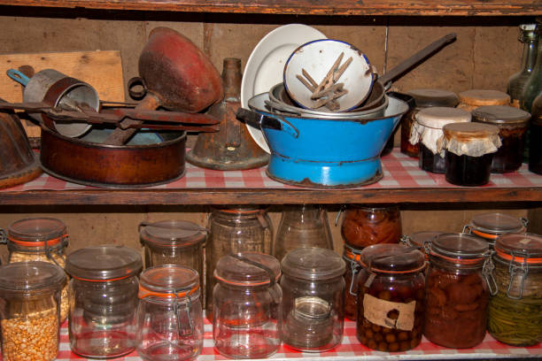 istock Old floor with jars and kitchen equipment 946525934
