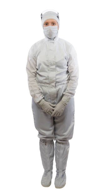istock woman in full growth, in white protective suit, on white 946531390