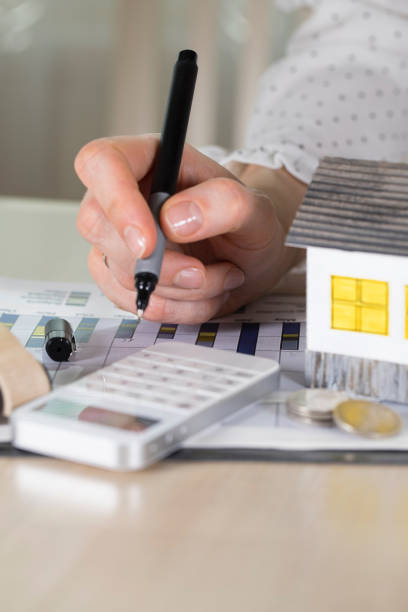 istock Young woman makes some calculations. 946531750