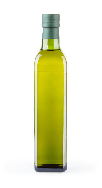 istock Olive oil in glass bottle isolated on white background with clipping path 946531940
