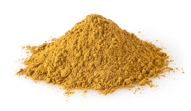 istock Heap of curry powder isolated on white background 946531946