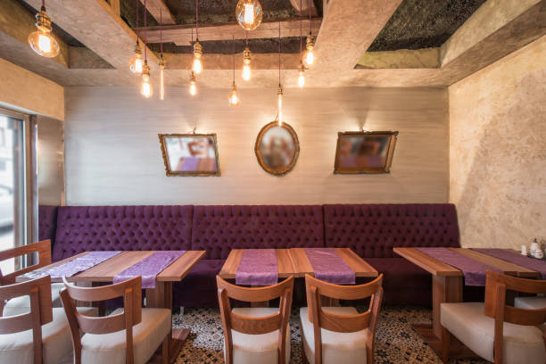 istock Modern restaurant interior, hanging bulbs on ceiling and tables 946533350