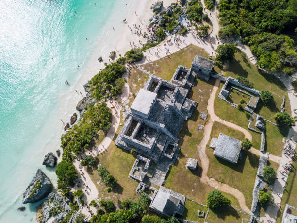 Ruins of Tulum, Mexico overlooking the Caribbean Sea in the Riviera Maya Aerial View. Tulum beach Quintana Roo Mexico - drone shot. mayan stock pictures, royalty-free photos & images