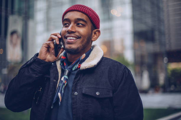 istock Man talking on phone outdoors 946538896