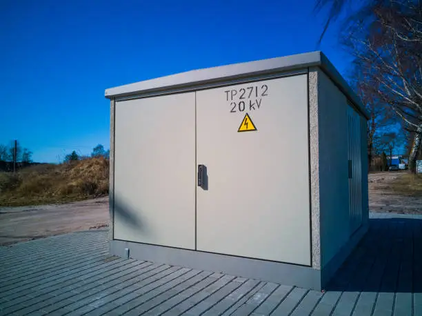 Nice and clean transformer box in a sunny day, with a lot of free space on the door, 20KV