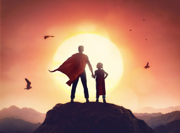 Father and daughter playing outdoors Happy loving family. Father and his daughter playing outdoors. Daddy and his child girl in an Superhero's costumes. heroes stock pictures, royalty-free photos & images