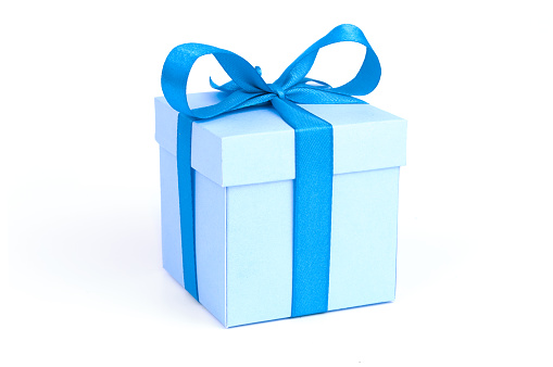 A blue gift box with blue ribbon isolated on white background