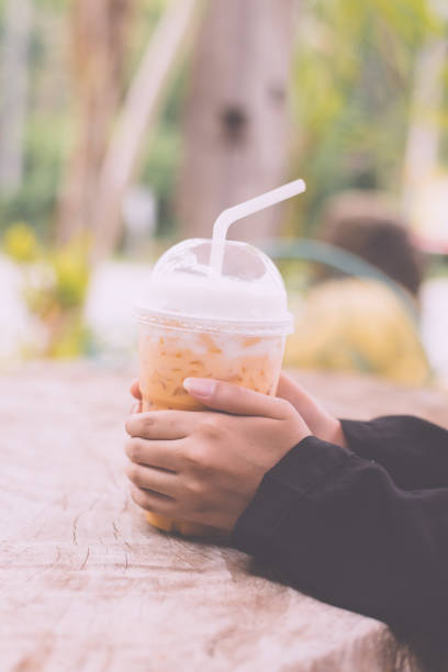 istock Ice thai tea on wooden table 946543216