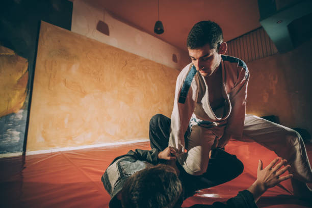 istock Jujitsu fighters in the gym 946546402