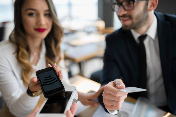 istock Female supervisor insisting to make wireless payment 946546738