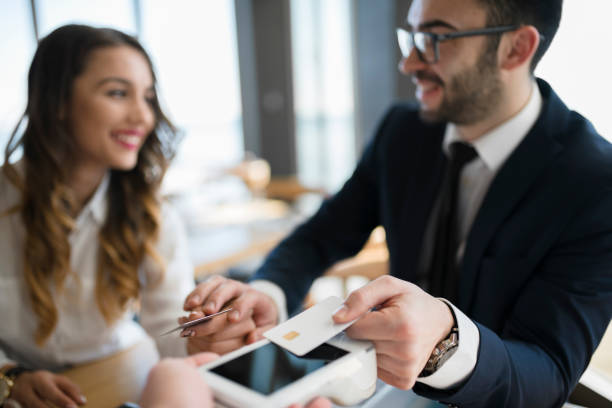 istock White collar worker insisting to pay for meal 946552882