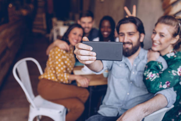 istock Friends making selfie at coffee shop 946556920