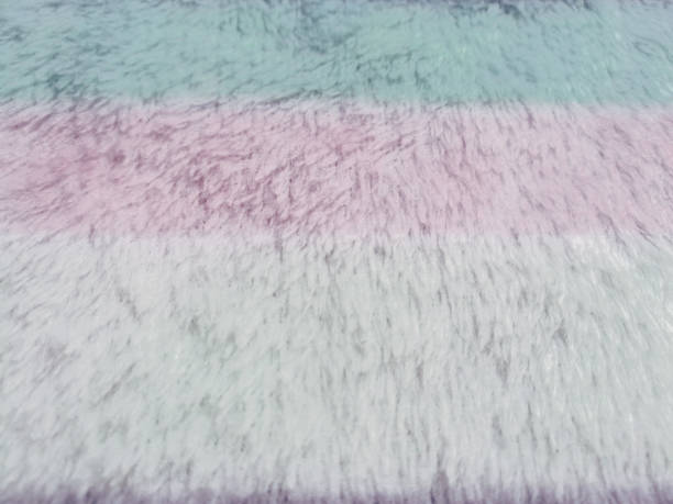 istock fur, feather and wool fabric texture background,crumpled fabric background. 946557292
