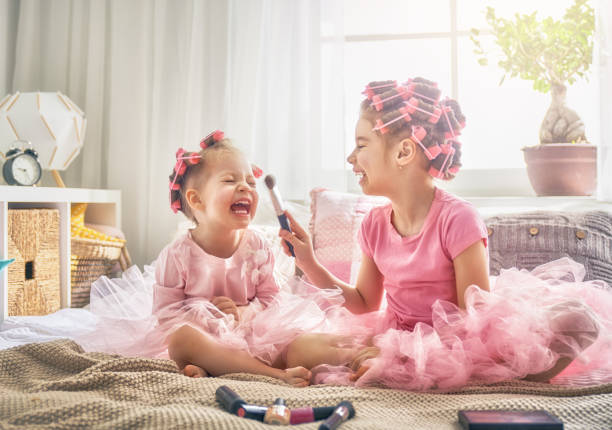 istock sisters are doing hair and having fun 946559912
