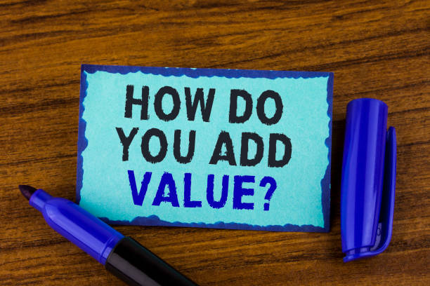 istock Text sign showing How Do You Add Value Question. Conceptual photo Bring business progress contribute earn written on Sticky Note paper on the wooden background Marker next to it. 946560288