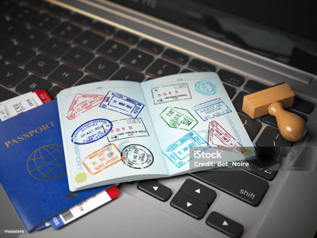 Visa online application concept. Open passport with visa stamps with airline boarding pass tickets and stamper on the computer keyboard. Visa online application concept. Open passport with visa stamps with airline boarding pass tickets and stamper on the computer keyboard. 3d illustration Passport Stamp Stock Photo