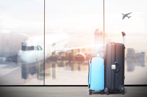 istock traveler suitcases in airport terminal 946562834