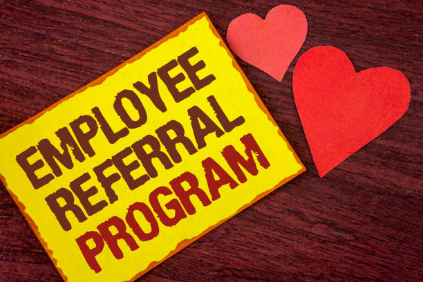 istock Conceptual hand writing showing Employee Referral Program. Business photo text Recommend right jobseeker share vacant job post written on Yellow Sticky note paper on wooden background Hearts. 946563522