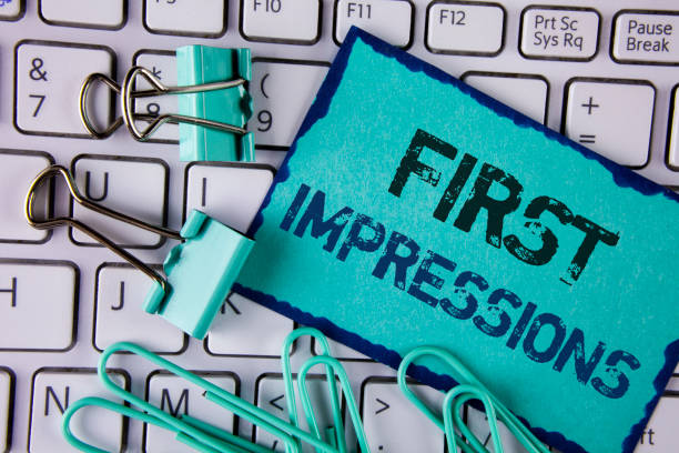 istock Handwriting text First Impressions. Concept meaning Encounter presentation performance job interview courtship written on Sticky Note paper placed on White Keyboard Clips and Paper Pins next to it. 946564318